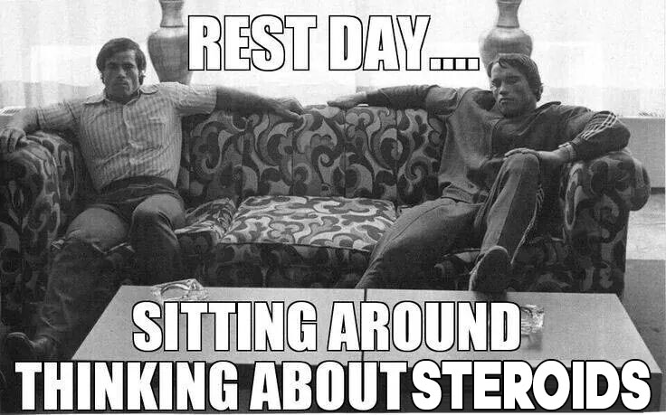 bodybuilders sitting on a couch waiting